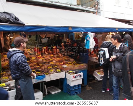 TOKYO, JAPAN - MAR 28: Tsukiji Outer Market in Tokyo, Japan on March 28, 2015.  Tsukiji Outer Market is a part of Tsukiji Market which is the biggest wholesale fish market in the world.