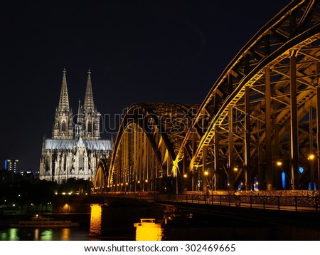 Cologne Cathedral and Hohenzollern Bridge at night - Cologne, Germany