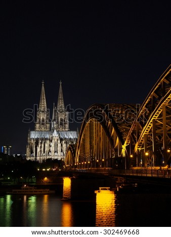 Cologne Cathedral and Hohenzollern Bridge at night - Cologne, Germany