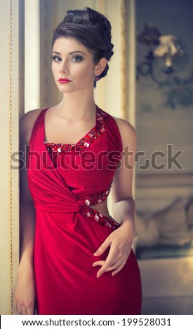 pretty brunette woman in a red dress