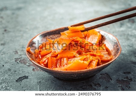 Similar – Image, Stock Photo Kimchi, fermented chinese cabbage in hot chili sauce , in bowl with chopsticks on rustic kitchen table. Close up