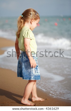 Small Girl Standing On Beach Stock Photo 4361629 : Shutterstock