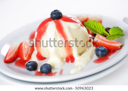 Sweet dumplings filled with fruits and strawberry sauce