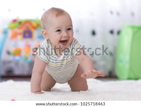 Similar – Image, Stock Photo Adorable little baby boy in feeding chair being spoon fed by his mother