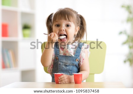 Similar – Image, Stock Photo Funny girl eating cream soup during lunch