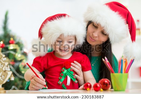 kid girl and her mother writing letter to Santa