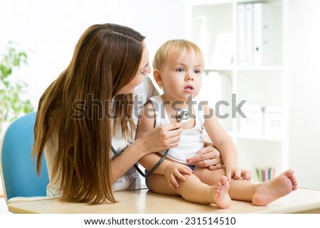 pediatrician woman examining heartbeat of kid boy with stethoscope