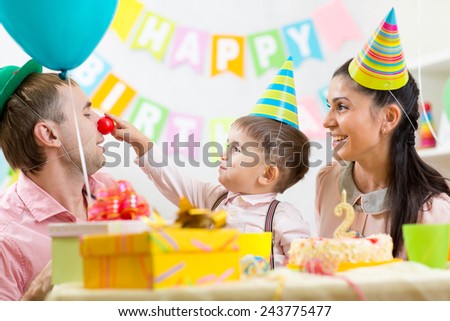 family having fun at child birthday party