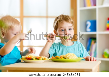 children eat healthy food in nursery or at home
