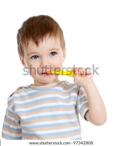 little child cleaning teeth and smiling, isolated on white background
