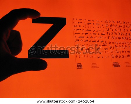 Arabic Alphabet and Hand on Red Background