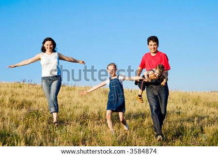 Family on the run. Father, mother, daughter and son