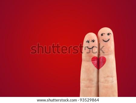 Photo of A happy couple in love with painted smiley