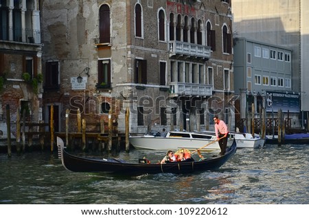 VENICE, ITALY - MARCH 28: Tourists on a Gondola, March 28, 2012 in Venice, Italy. The city has an average of 50,000 tourists a day and it\'s one of the world\'s most internationally visited city