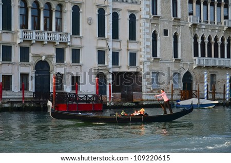 VENICE, ITALY - MARCH 28: Tourists on a Gondola, March 28, 2012 in Venice, Italy. The city has an average of 50,000 tourists a day and it\'s one of the world\'s most internationally visited city
