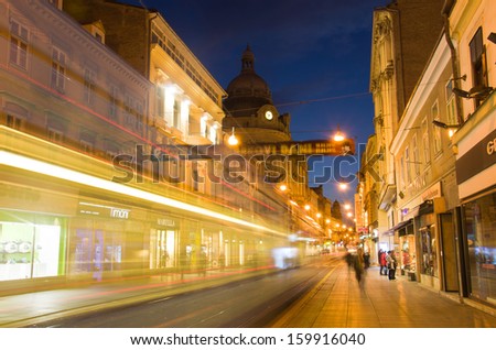 ZAGREB, CROATIA - MARCH 18: People walk at night along Ilica street on March 18, 2012 in Zagreb, Croatia. Ilica is one of the longest and the most expensive residential street in the city.
