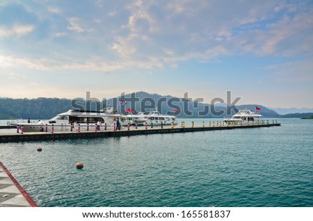 SUN MOON LAKE - OCT 25: many boats parking at the pier on October 25, 2013 at Sun Moon Lake, Taiwan. Sun Moon Lake is the largest body of water in Taiwan as well as a tourist attraction.