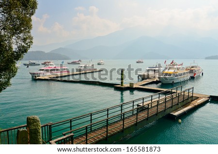 SUN MOON LAKE - OCT 25: boats parking at the pier on October 25, 2013 at Sun Moon Lake, Taiwan. Sun Moon Lake is the largest body of water in Taiwan as well as a tourist attraction.