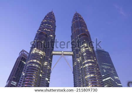 KUALA LUMPUR, MALAYSIA -MAY 11: Petronas Twin Towers at day on May 11, 2014 in Kuala Lumpur. Petronas Twin Towers were the tallest buildings (452 m) in the world from 1998 to 2004