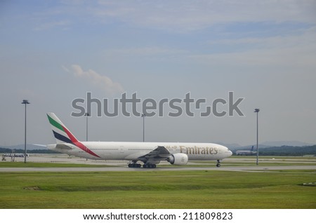 SEPANG, MALAYSIA - MAY 8: Emirates plane, Boeing 777-31H(ER), Registration name A6-ECY, ready to landing at KLIA airport on May 8, 2014 in KLIA, Sepang, Malaysia.
