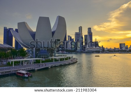 SINGAPORE, SINGAPORE - MAY 13: The skyline of Singapore lit up at night with the ArtScience Museum in the foreground. Photo taken May 13, 2014 in Singapore, Singapore.