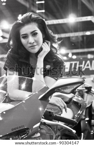 BANGKOK - DECEMBER 3: Female presenters model at the Ducati booth during Bangkok International Motor Show at Impact Challenger on December 3, 2011 in Bangkok, Thailand.