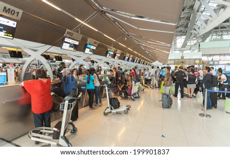 BANGKOK - JUNE 21 :  Passengers checking in at Suvanaphumi Airport, Bangkok on JUNE 21, 2014,Suvarnabhumi airport is world\'s 4th largest single-building airport terminal.