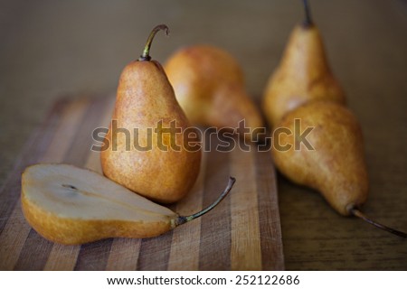 Group of ripe pears on wooden table
