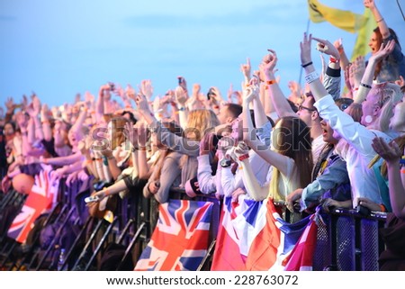 MINSK, BELARUS - JULY 03: People crowd with british flags during 'Most festival' on July 3, 2014 in Milnsk, Belarus.