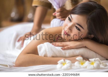 Masseur doing massage on asia woman body in the spa salon. Beauty treatment concept.