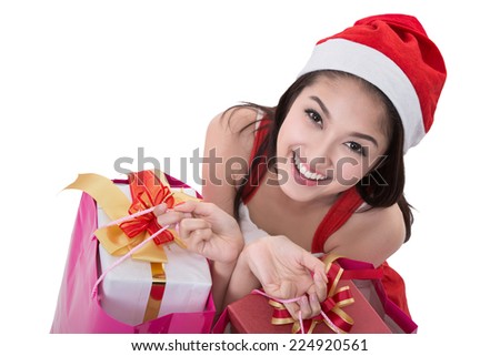 Beautiful Asia woman wear Santa Clause costume, christmas girl happy smile hold new year gift box present (clipping part for easy to use)