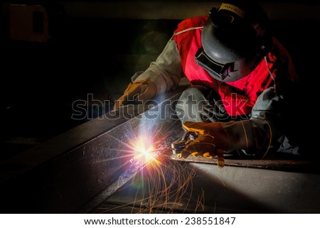 worker work hard with welding process in production plant