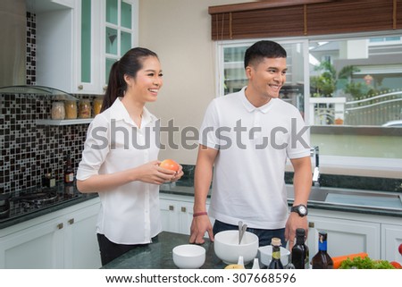 Family just married in kitchen room and prepare food for dinner