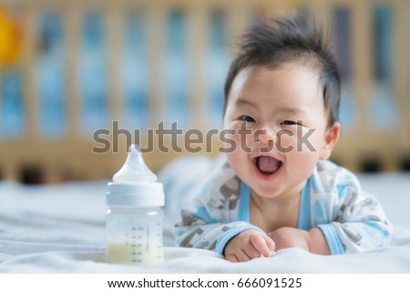 Similar – Image, Stock Photo Toddler drinking milk bottle