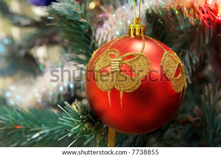 red Christmas ball hanging on branch