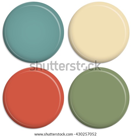 four magnetic refrigerator buttons in different colors