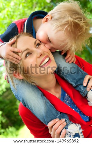 Happy mother and son having a nice day in the park