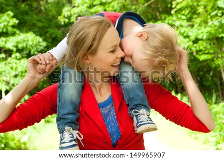 Happy mother and son having a nice day in the park