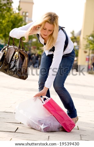 Beauty young girl shopping in the sunny weather