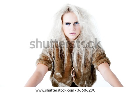 Model with wild white hair in a waiting pose with a fierce look. Usable for health and beauty, cosmetics, love, hate and emotional issues.