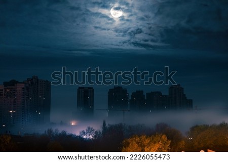 Similar – Image, Stock Photo Lights over the city. Two upward shining white stripes in the blue sky above the houses.