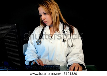 A doctor at a computer terminal
