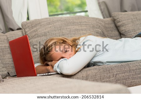pretty girl fall asleep in front of laptop