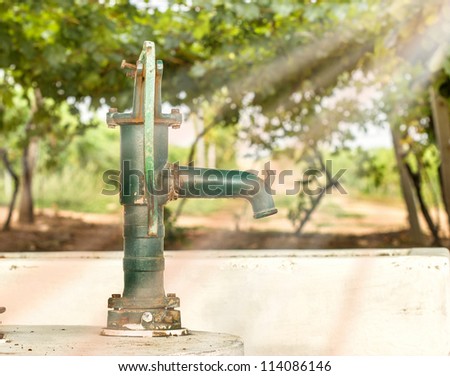 Hand water pump in the vineyard