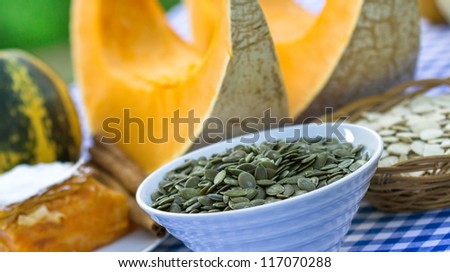 Pumpkin seeds, pumpkin cake and slices of pumpkin