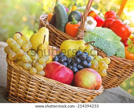 Fresh organic seasonal fruits and vegetables in wicker baskets