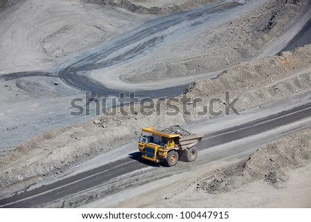 Open pit mine with supersize car