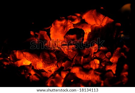 carbons of bonfire on black background