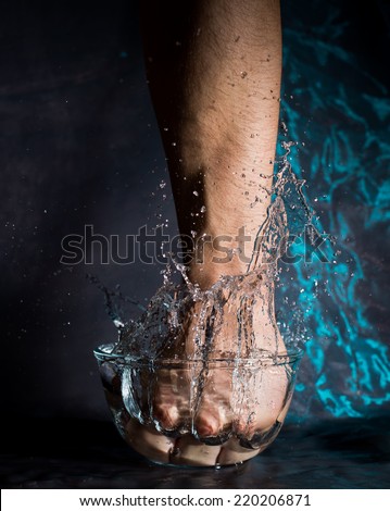 Fist Punching into Water with Splash - Metaphor for Power, Speed