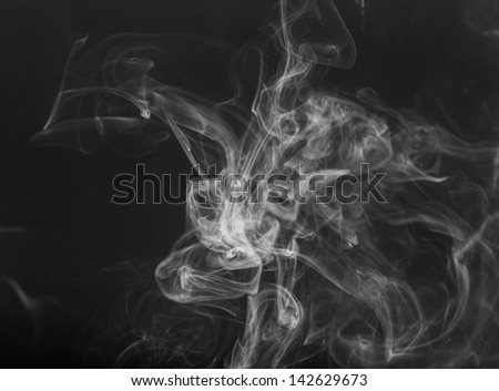 Dense smoke from a cigarette, abstract background